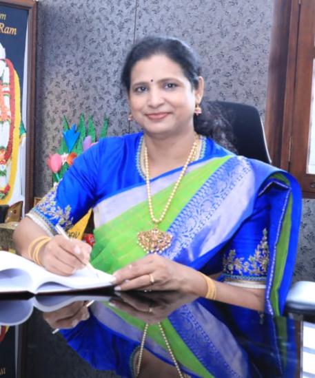 Smt. Bharathi Srinivas, Secretary of Anikethana Vidya Mandira, at her desk
