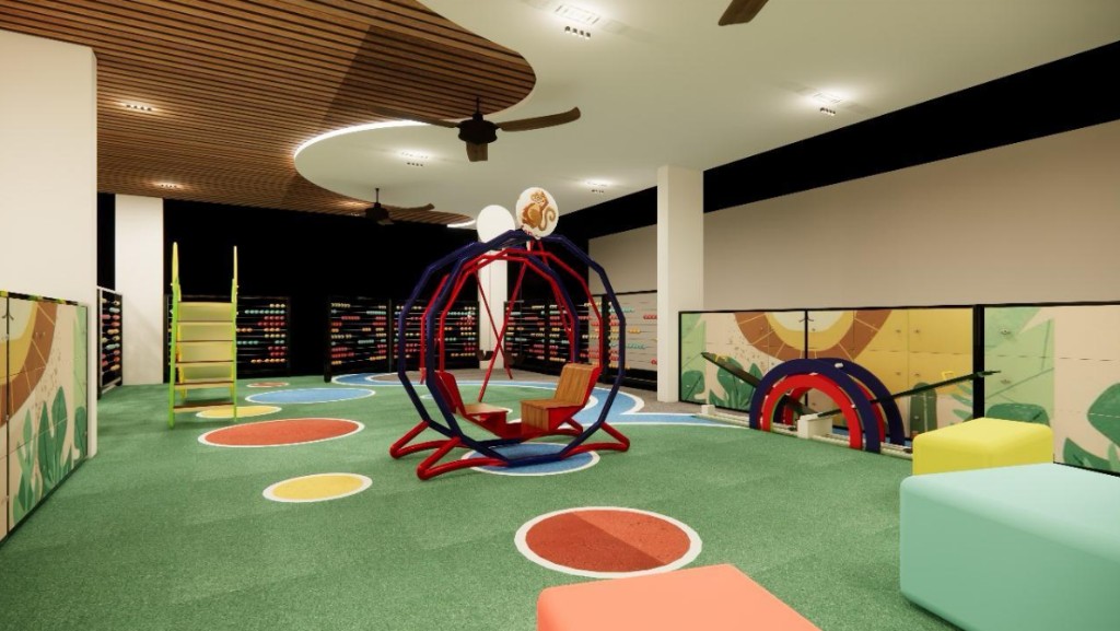 Another perspective of the supervised indoor play area with bright equipment.